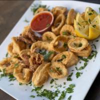 Fried Calamari · Delicious thick cut calamari breaded and fried to perfection with a side of marinara sauce