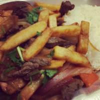 Lomo Saltado · Our famous stripped beef sauteed in olive oil, red onions, tomatoes, fried potatoes and fres...
