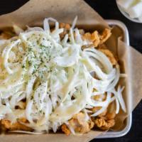 Sweet Onion Popcorn Chicken · Crispy boneless hand bread and fried topped with thinly shredded onion and secret creamy whi...