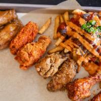 Chicken Sampler · 8pcs of chicken wings with 4 different flavors! Comes with kimchi fries. Add bulgogi for an ...