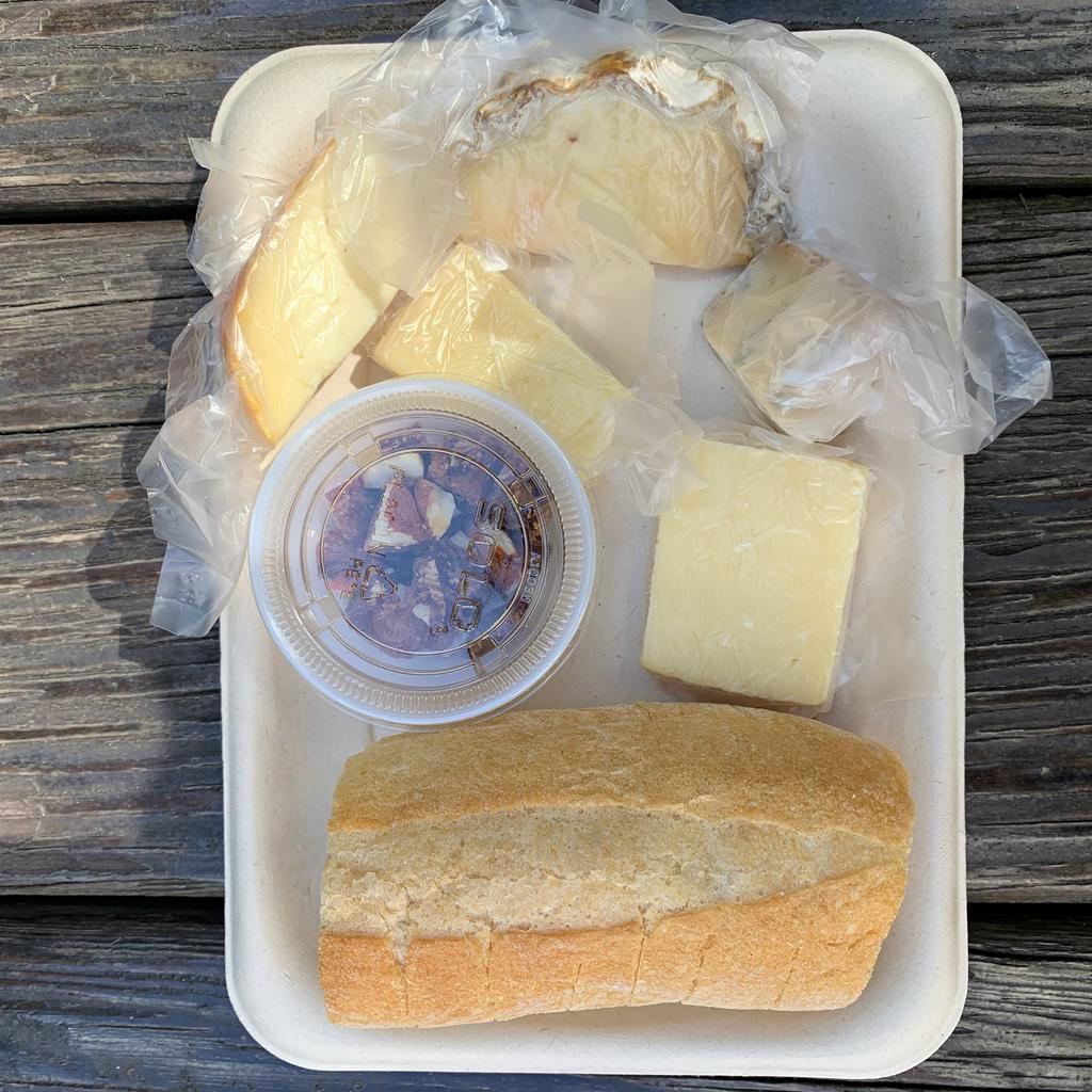 Large Cheese Plate · 5 of our favorites. Feeds about two people -- each piece of cheese is 0.5 OZ for a total of 2.5 OZ of cheese  (cheddar cow's milk, sheep's milk,swiss cheese,washed rind cow's milk, blue cheese cow's milk) side of bread & fig almond cake.