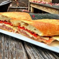 The Spaniard Sandwich · Serrano ham, Manchego, piquillos sherry vinegar and olive oil on a crunchy baguette (onions ...