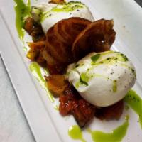Burrata · Roast plum and golden tomato compote extra virgin olive oil and pancetta chips.