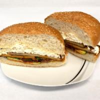 Cemitas · Beans, Mayonaise, Meat, Chipotle, Avocado, Quesillo, Papalo, Onions layered on a sesame bun ...