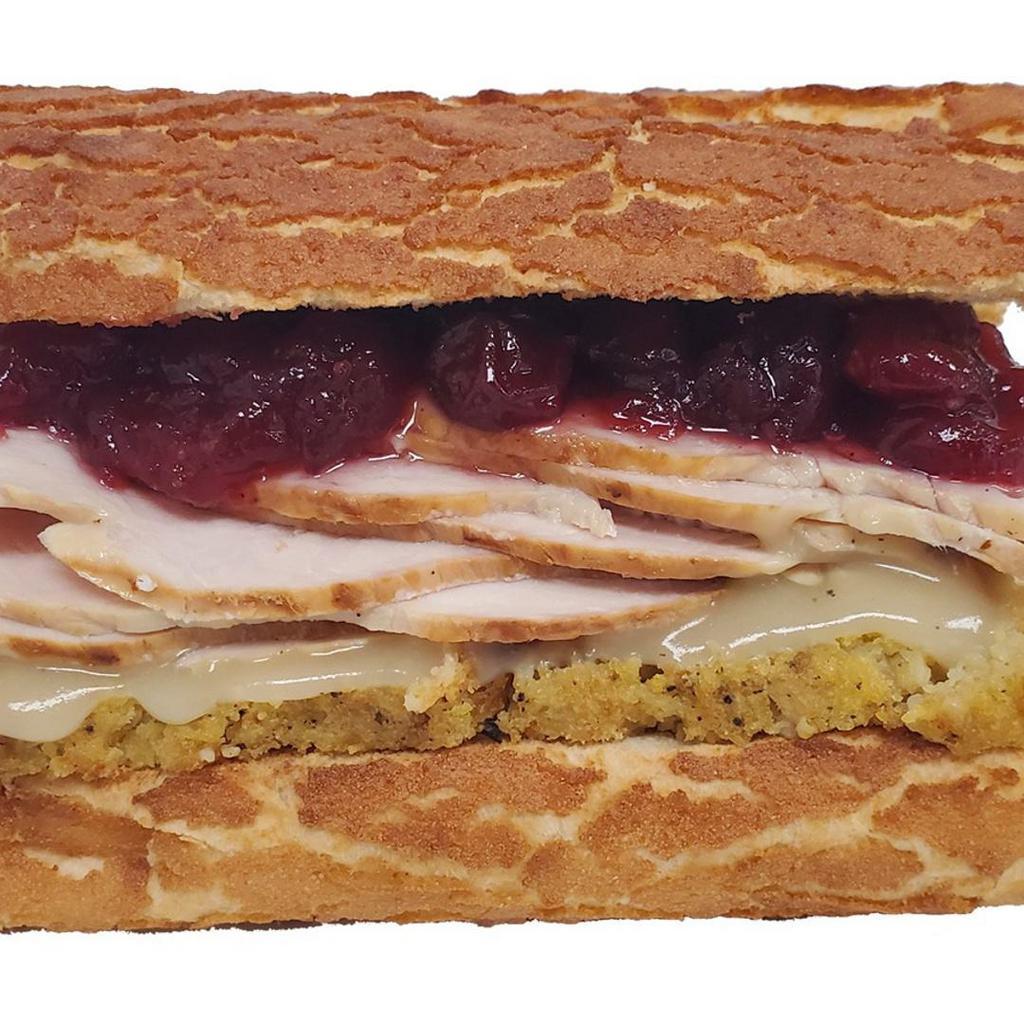 Thanksgiving Turkey & Cranberry Sandwich · Dutch crunch roll, mayonnaise, Dijon mustard, cornbread stuffing, savory gravy, cranberry sauce, homestyle turkey.