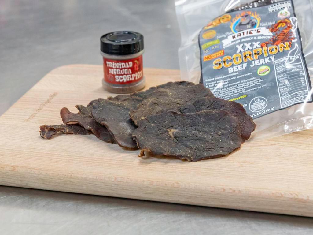 ScorpionXXX Beef Jerky · Somebody pull the fire alarm! Made with the world's hottest chile pepper, the Trinidad moruga scorpion pepper, this flavor is not for the faint of heart! If you’re looking for the super hot and super intense flavor, your search is over! We take our scorching scorpion recipe and spread straight peppers all over the top for the hottest jerky on the planet! We even manage to keep an amazing amount of flavor! If you want to add a boost of flavor and dial it down a notch – don't worry, we're still going to light you up! – try our scorpion jerky. 1.8 oz.