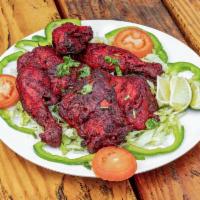 11. Full Tandoori Chicken · Served with salad, green lime, mint, and red hot salsa.