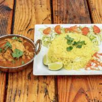 13. Chicken Curry · Served with rice and salad.