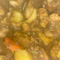Curry Chicken · Served with rice & beans and cabbage.