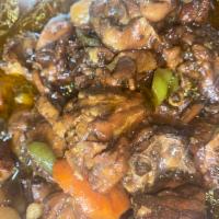 Stew Chicken  · Served with Rice & Beans and Cabbage 