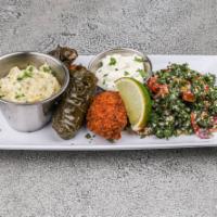 Veggie Platter · Falafel, hummus, baba ganoush, grape leaves, tabouli and Greek salad.