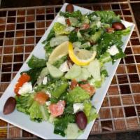 Greek Salad · Romaine lettuce, tomato, cucumbers, onions, olives, feta cheese tossed in our house dressing.