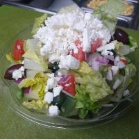 Greek salad  · Romaine lettuce, tomatoes, cucumber, red onion, imported feta cheese, kalamata olives and Di...