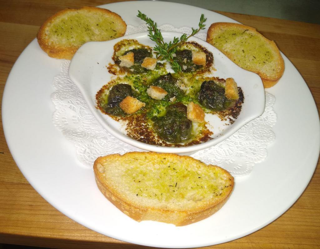Sauteed Escargot  · Sauteed Escargot in parsley, garlic, lemon, butter server with toasted baguette 