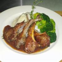 Rack of lamb  · Oven roasted Lamb chops served with mashed potatoes and sautéed broccoli 
