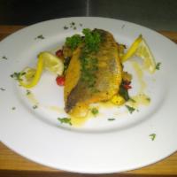 Pan-seared Branzino  serve with sautéed Spinach, mix spring vegetables and white wine butter sauce. · Pan-seared branzino serve with sautéed Spinach, mix spring vegetables and white wine butter ...