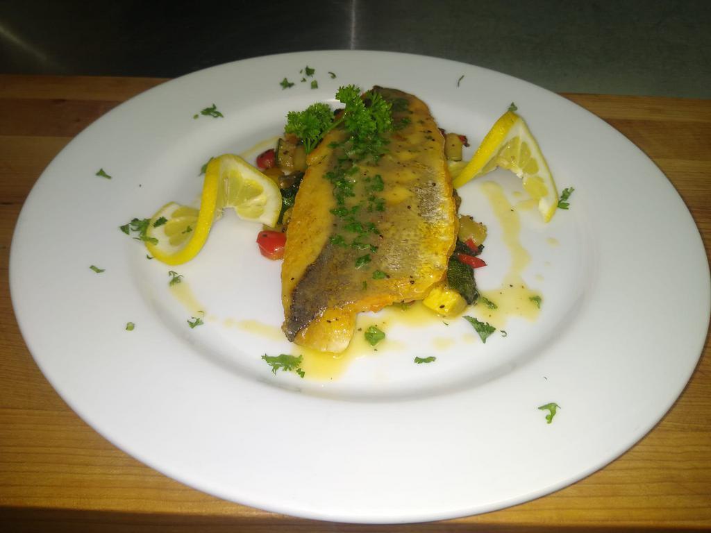 Pan-seared Branzino  serve with sautéed Spinach, mix spring vegetables and white wine butter sauce. · Pan-seared branzino serve with sautéed Spinach, mix spring vegetables and white wine butter sauce.