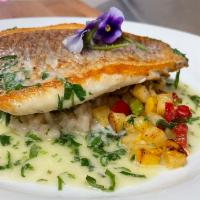 Pan seared 12 oz red snapper, Served with porcini risotto, sauteed mixed vegetables  and white wine butter capers sauce.  · Served with porcini risotto, sauteed mixed vegetables  and white wine butter capers sauce. 