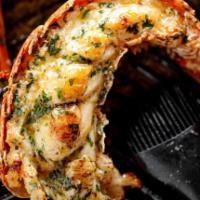 Grilled Lobster · Cooked on a rack over a grill. Served with fries, salad or rice.