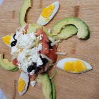 Avocado Egg Salad  · 2 boiled eggs, avocado, feta cheese, tomatoes, cucumber, onions, olives and house dressing.
