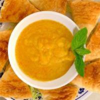 Paratha Dip (Vegan).. · Air Fried multi-layered Roti Parathas served with Coconut Curry dipping sauce and Pickled Ca...