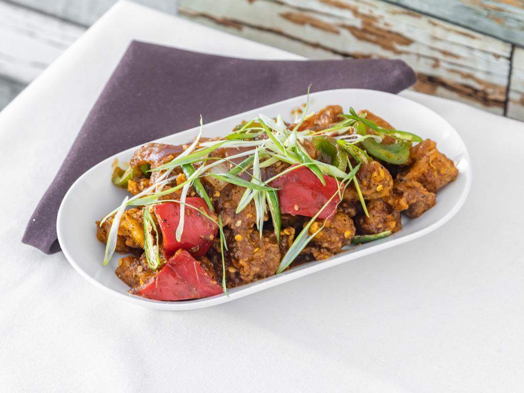 Chili Chicken · Deep fried chicken pieces tossed in a chili sauce with Indian spices.