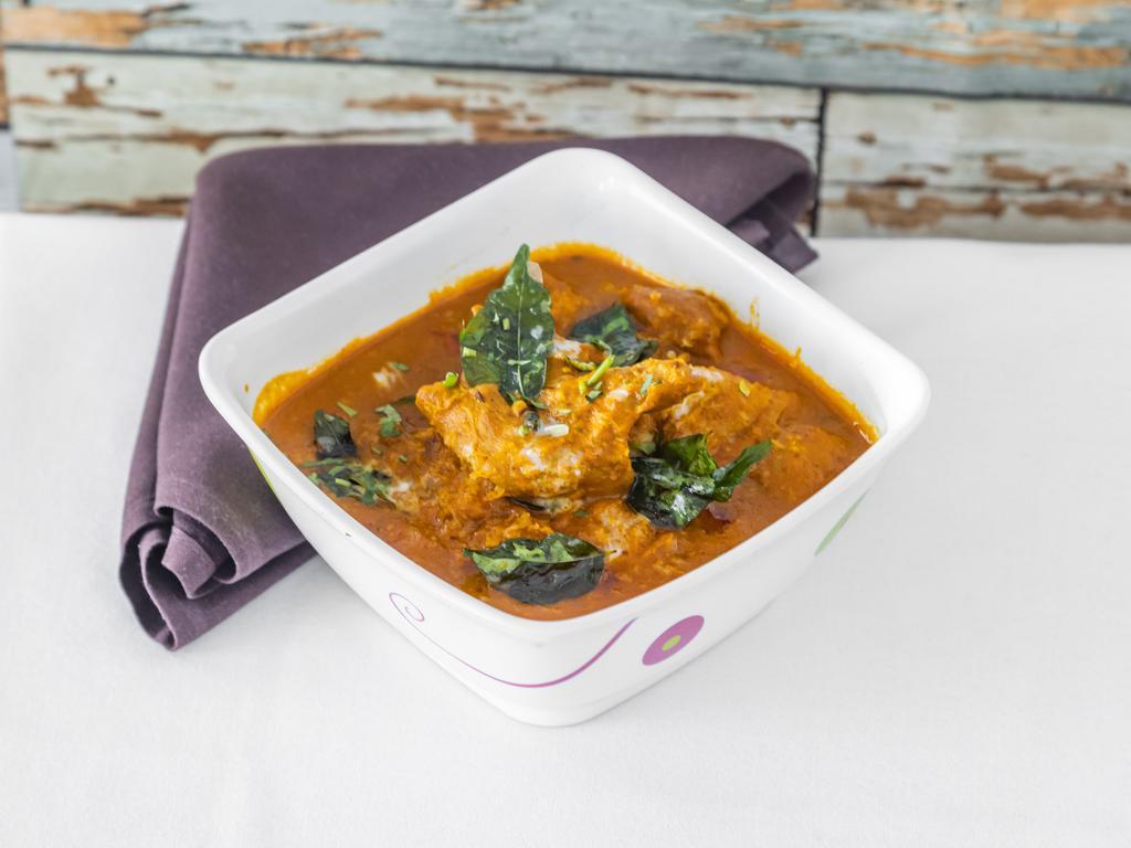 Chicken Chettinad · Chicken made with roasted ground exotic spices peppercorn, star anise and coconut.