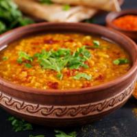 Dal Tadka · Boiled yellow lentil tempered with cumin, mustard, garlic and curry leaves.