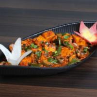 Paneer Tikka Masala · Cottage cheese cooked in creamy and tomato gravy with combination of onion, peppers and toma...