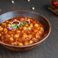 Chana Masala · Traditional chickpeas dish cooked in ginger, infused onion and tomato sauce.