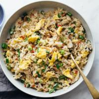 Egg Fried Rice · Steamed rice stir fried on a wok along with eggs and freshly chopped garlic, ginger and vege...
