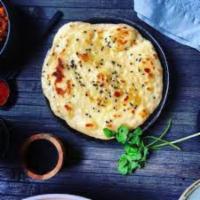 Butter Naan · Whole wheat flour mixed with butter, milk, yogurt and cooked traditionally in clay oven.