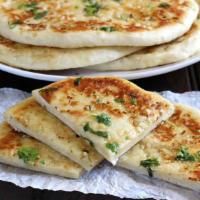 Cheese Naan · Whole wheat flour mixed with Cheese, butter, milk, yogurt and cooked traditionally in clay o...