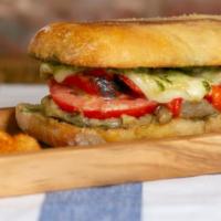 Veggie Wompler · Fresh Tomatoes, Roasted Red Peppers, Roasted Mushrooms, Caramelized Onions, Basil Pesto, Oil...