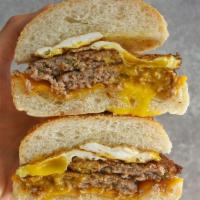 SAUSAGE EGG AND CHEESE ON A ROLL · 2 EGGS, COOKED SUASAGE AND MELTED AMERICAN CHEESE ON A ROLL