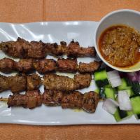 A4. Beef Satay · 4 Skewers. Marinated beef with Malaysia spices grilled to perfection served with chef specia...