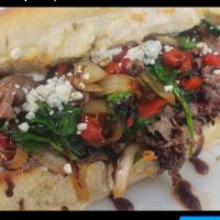 5. Alyssa Special · Seasoned roast beef topped with baby greens, roasted red peppers, caramelized onions, garlic...