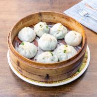 Beef and Chive Momo · 8 pieces. Steamed beef and chive mix dumpling.