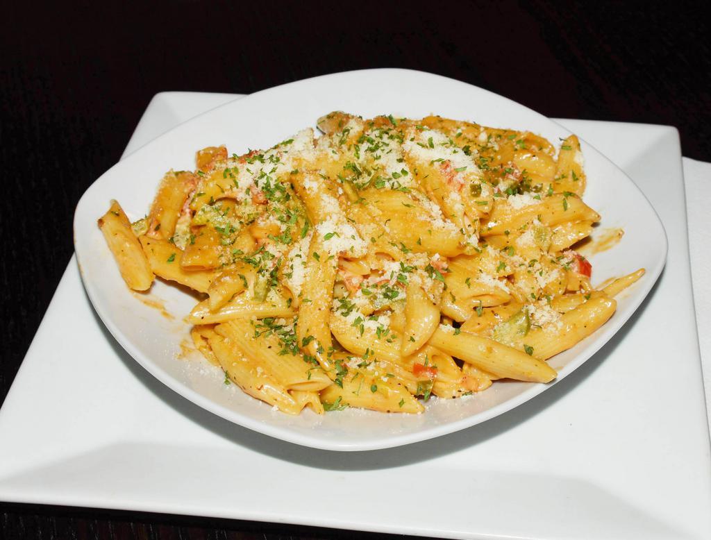 Irie Pasta · Breezes Irie Pasta is a  dish made with bell peppers, onion, creamy sauce and Caribbean seasonings