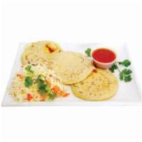 4. Pupusas de Frijol y Queso · A traditional dish made of a thick handmade corn tortilla stuffed with beans and cheese.
