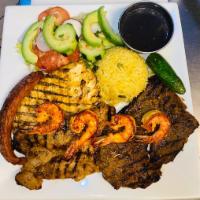 31. Mar y Tierra · Beef, chicken breast and shrimp. Served with rice, beans, salad and tortilla.