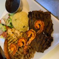 32. Carne Asada con Camarones · Served with shrimp,rice,beans,salad and tortilla
