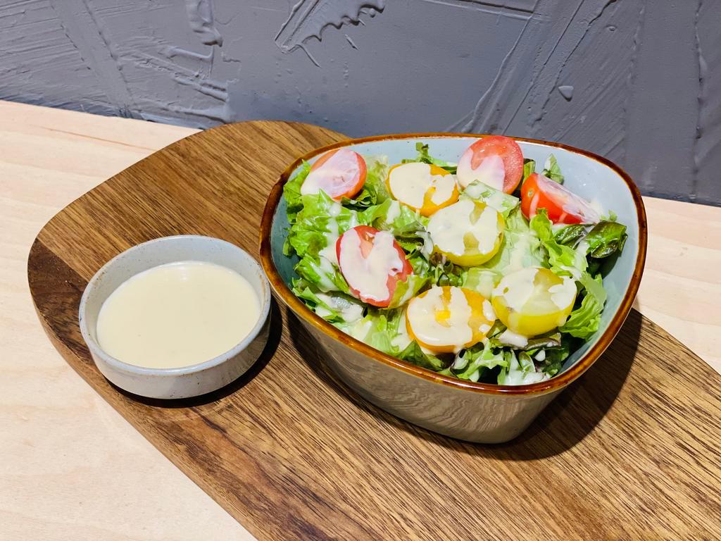 House Salad · Red leaf, cherry tomatoes, house made creamy salad dressing