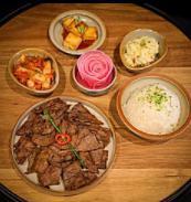 Beef Bulgogi Bento · Served with rice, side dishes and salad.