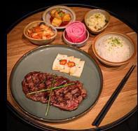 Wagyu Skirt Steak Bento · Served with rice, side dishes and salad.