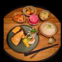 Salmon Bento · Served with rice, side dishes and salad.