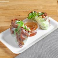Grilled Pork Rolls  · 2 pieces. Our grilled pork wrapped in a clear rice paper with lettuce, cilantro, mint and no...
