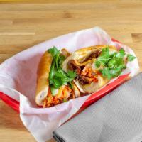 Grilled Pork Sandwich · Our most popular banh mi.Thinly sliced lemongrass marinated pork grilled to perfection on a ...