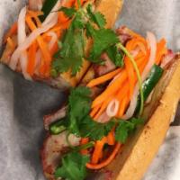 BBQ Pork Sandwich · Thick sliced pork steamed to the style of Chinese BBQ  on a toasted French baguette with but...