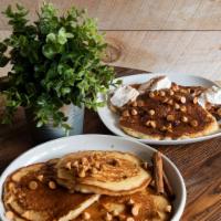 Butterscotch Pancakes · Butterscotch pancakes, in-house cinnamon whip cream, and organic maple syrup.